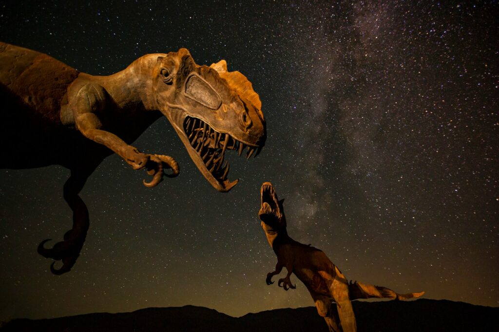 Two T-Rex dinosaurs of different sizes