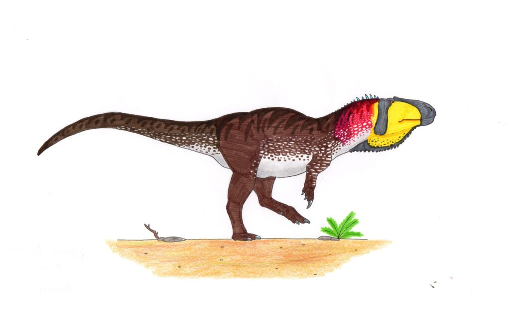 Illustration of a dinosaur with a spotted brown body, red and yellow head, and prominent black snout. It walks on a sandy terrain with sparse greenery.