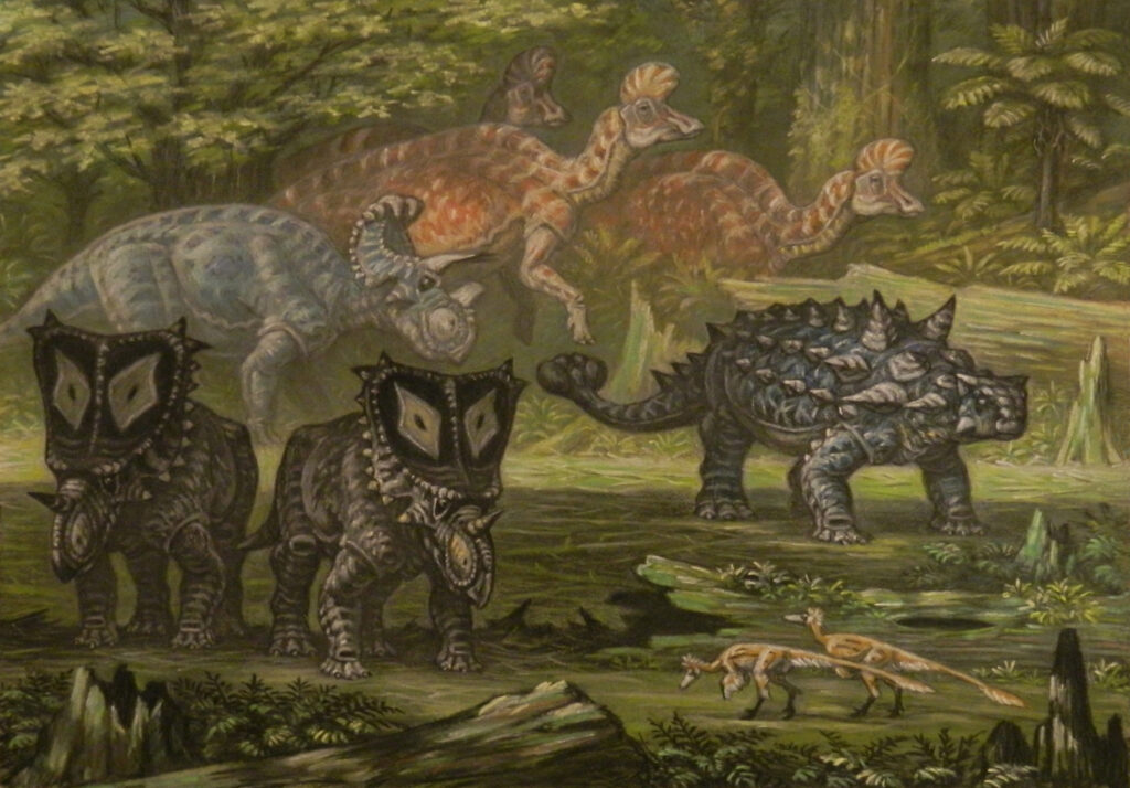 A prehistoric scene features two horned dinosaurs with shield-like frills, a spiky armored dinosaur, and two smaller dinosaurs, set in a lush, green forest.