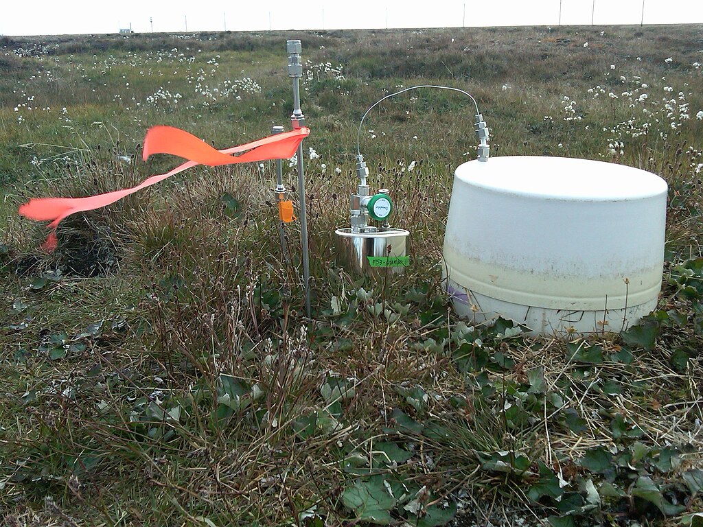 Gas samples for stable isotope analysis are collected from tundra environments to study past climate and ecological conditions.