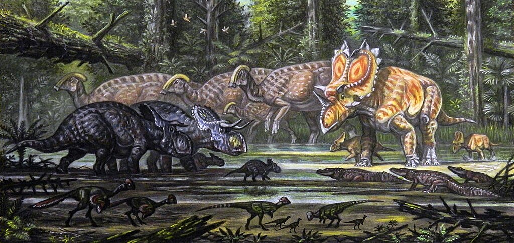 Animals by a Kaiparowits Formation swamp including Nasutoceratops titusi, Utahceratops gettyi, Brachychampsa, pachycephalosaurs, Hagryphus giganteus, and Parasaurolophus cyrtocristatus.