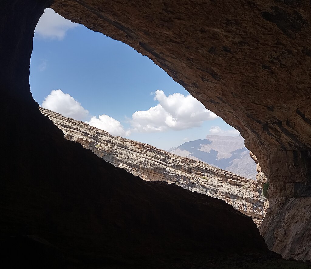 Cropped photo of a grotto on Chul-Bair mountain, Uzbekistan, in a canyon with dinosaur footprints, above the cave Boybuloq