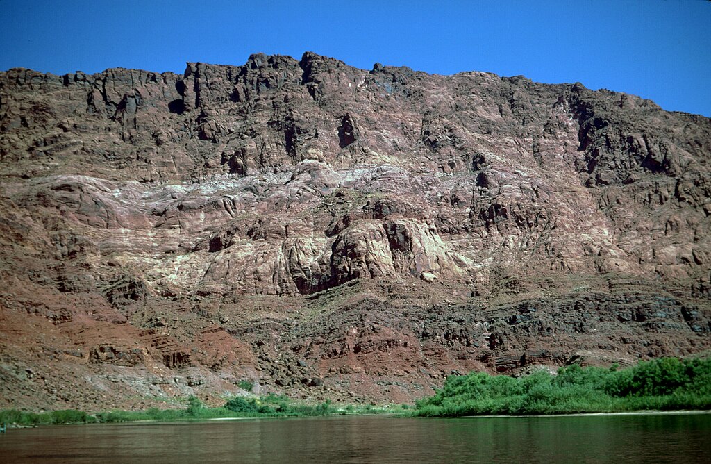 View east and upriver from Lees Ferry toward Triassic and Jurassic rocks of the Echo Cliffs. Petrified Forest and Owl Rock Members of Chinle Formation at river level
