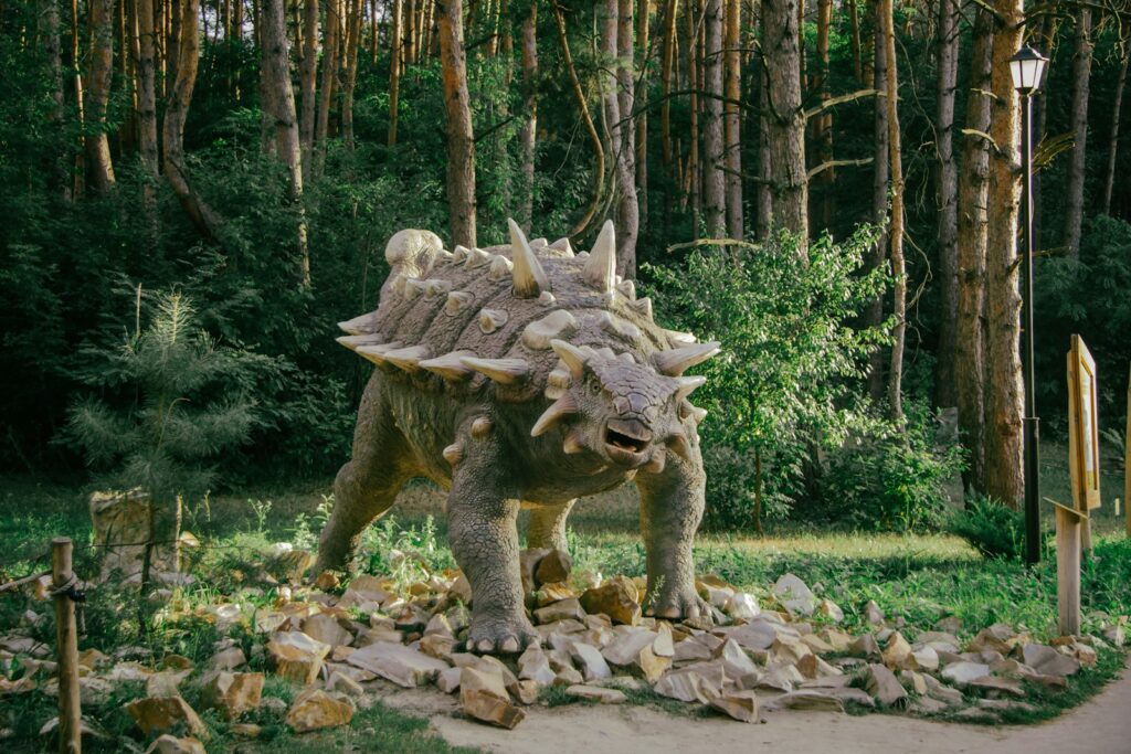 a triloon walking through a forest filled with rocks