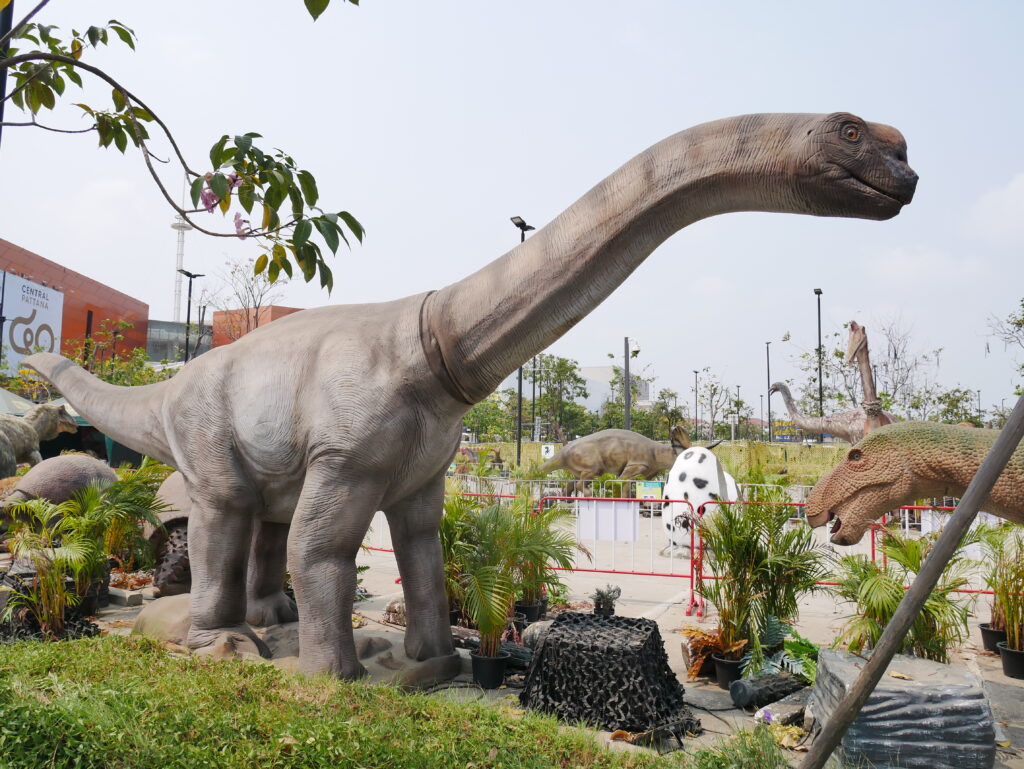 Large dinosaur statues in an outdoor exhibit at Central Plaza Mahachai, Samut Sakhon, Thailand.