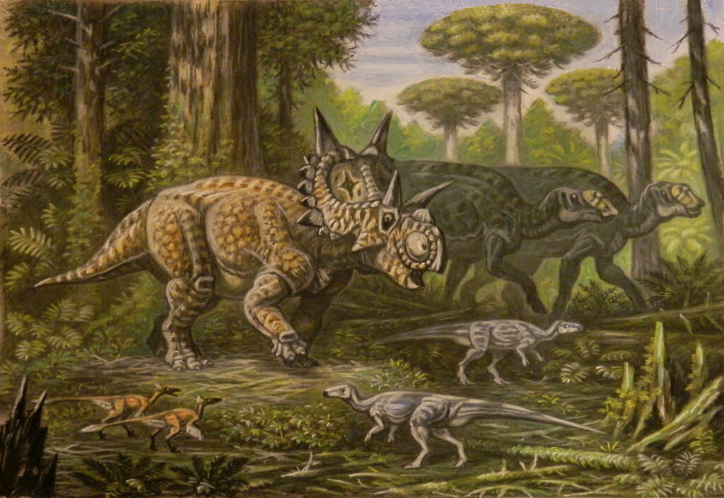 Dinosaurs roam a lush forest, with a horned creature and armored species in the foreground. The scene conveys a prehistoric, natural setting.