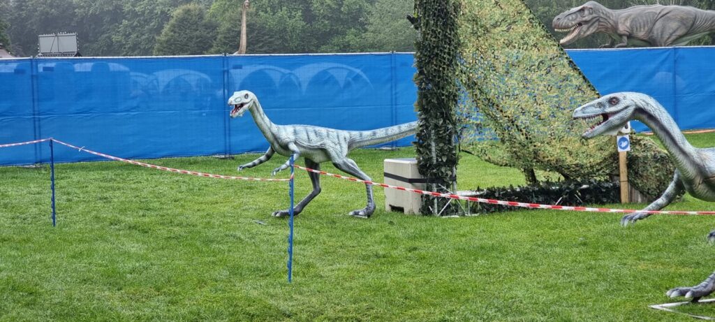 white and blue inflatable horse on green grass field