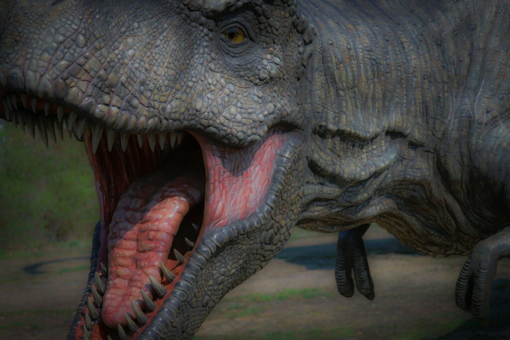 a close up of a dinosaur with its mouth open