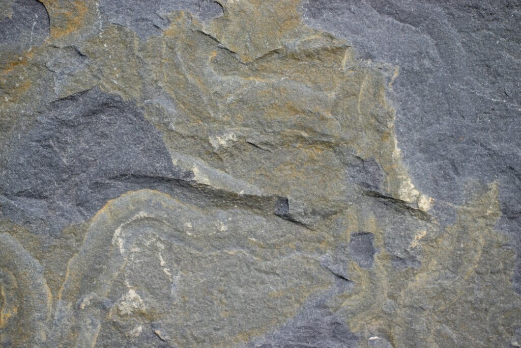 a close up of a rock with a horse on it