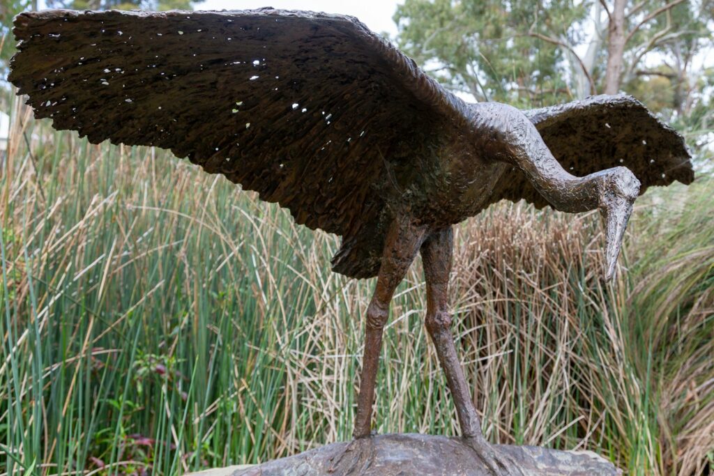 a statue of a bird with its wings spread